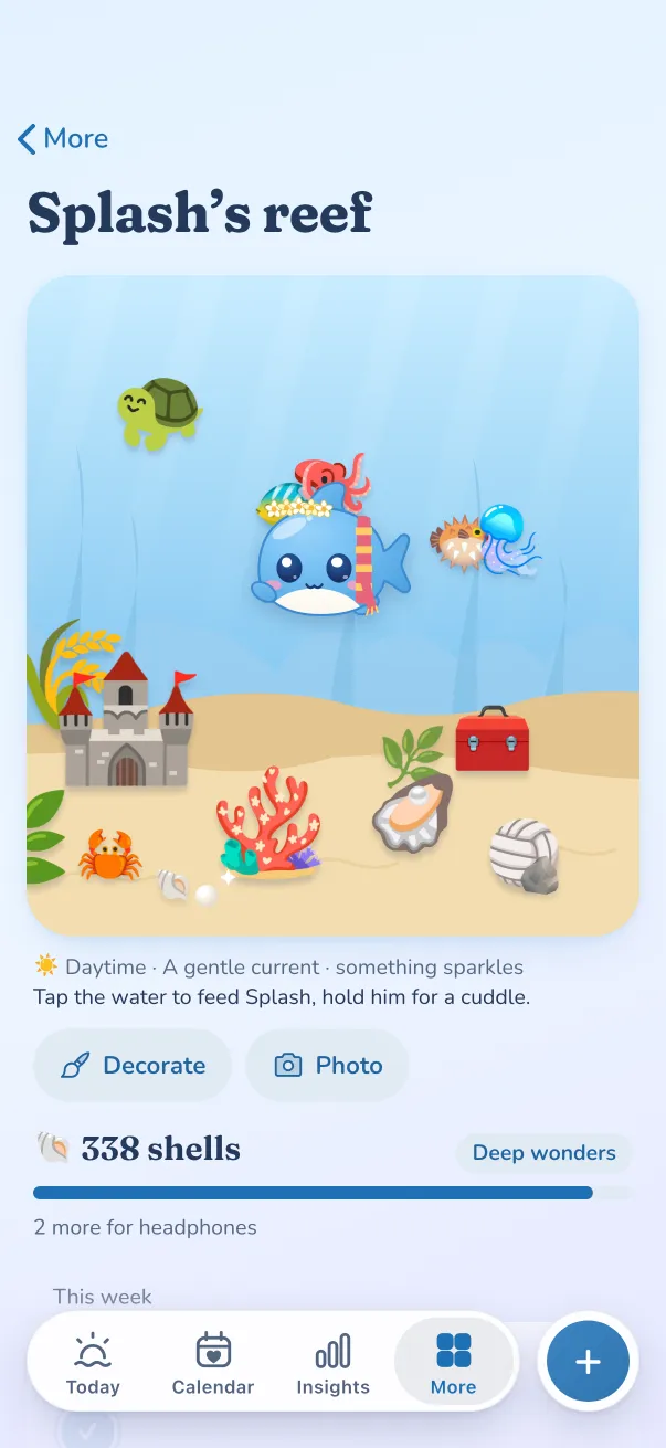 Splash’s reef: Splash in a flower crown and scarf, a turtle, pufferfish and clownfish, a sandcastle, coral, clam and ball